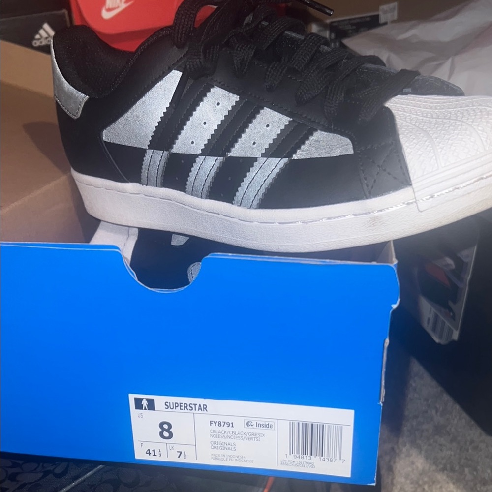 Adidas Black and Silver Athletic Shoes with Signature Stripes